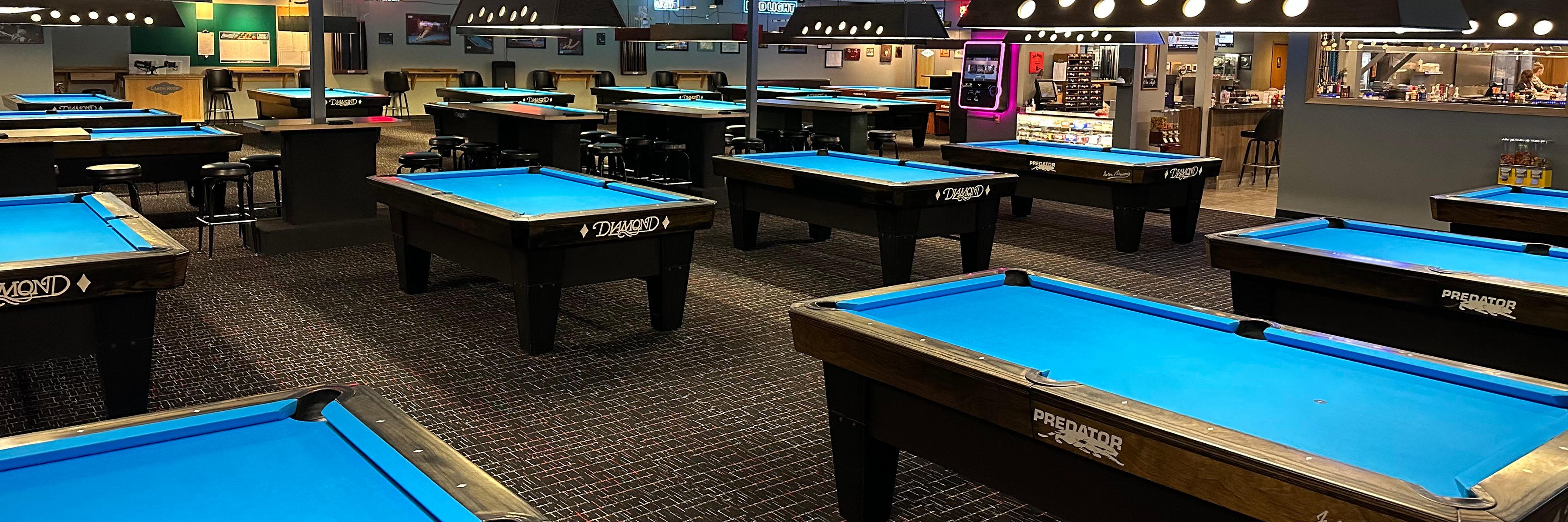The Carom Room is a premier pool room providing an exceptional experience with Diamond billiard tables, tournaments, leagues, a full bar, and food.
